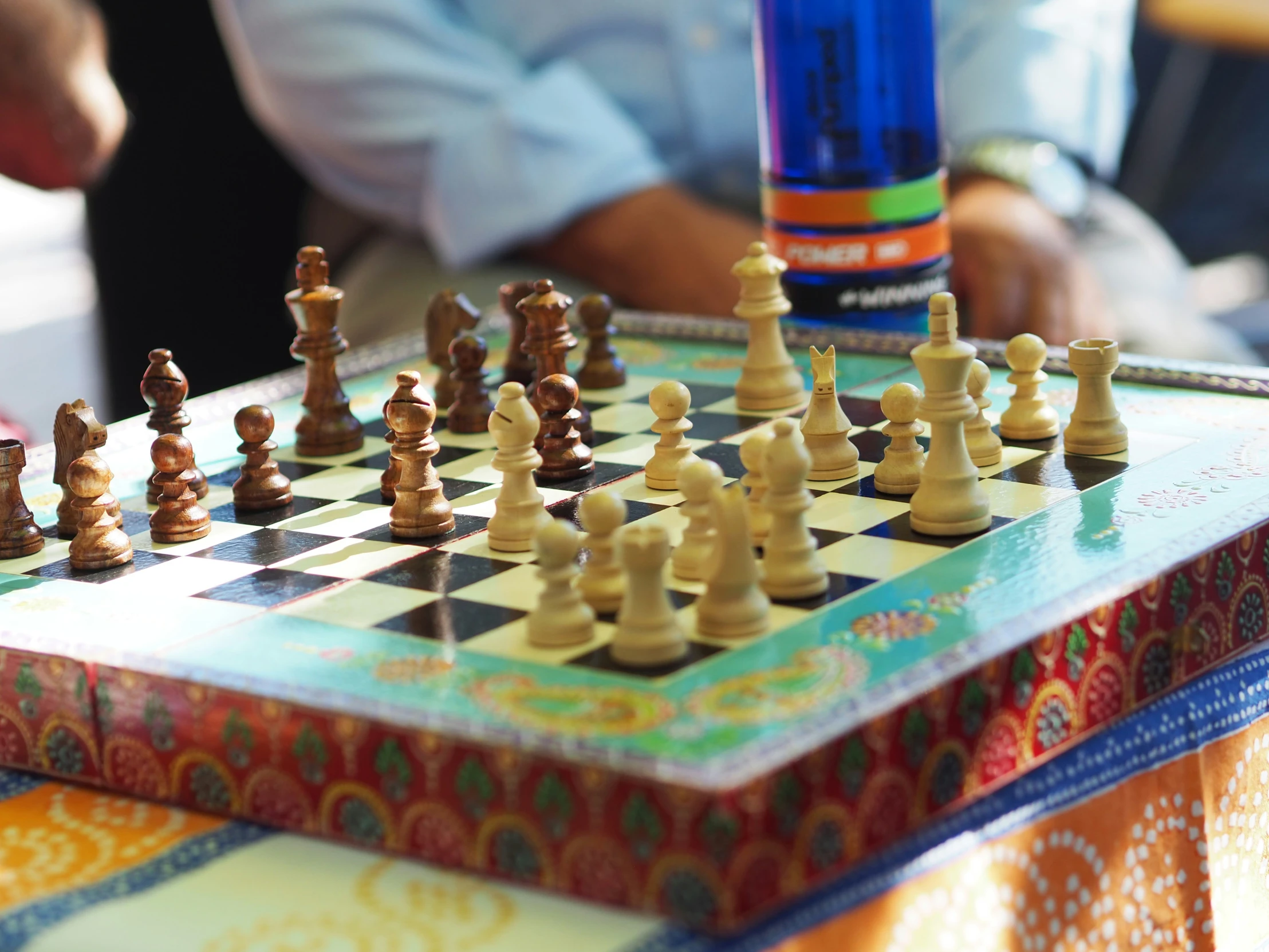 a chess board with pieces on top of it