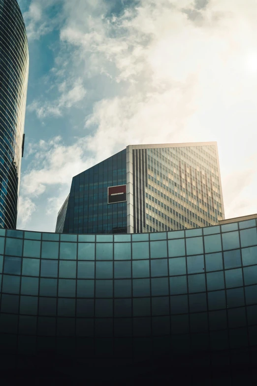 a view of tall buildings with different glass shades