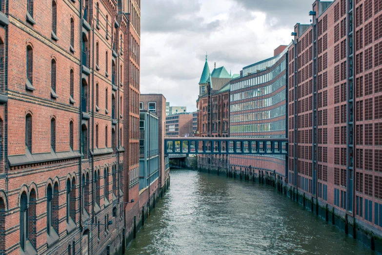 the view of buildings, water, and bridge from near the docks