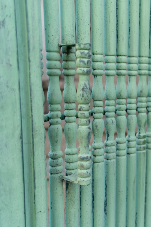 close up view of bamboo fence, made of green paint