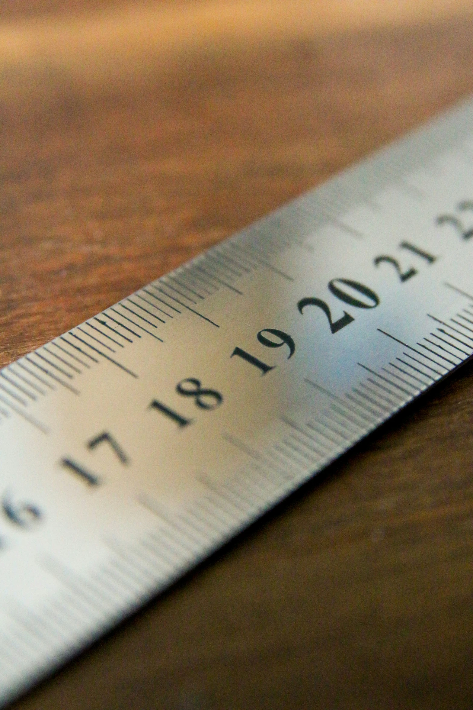 a ruler sitting on top of a wooden table