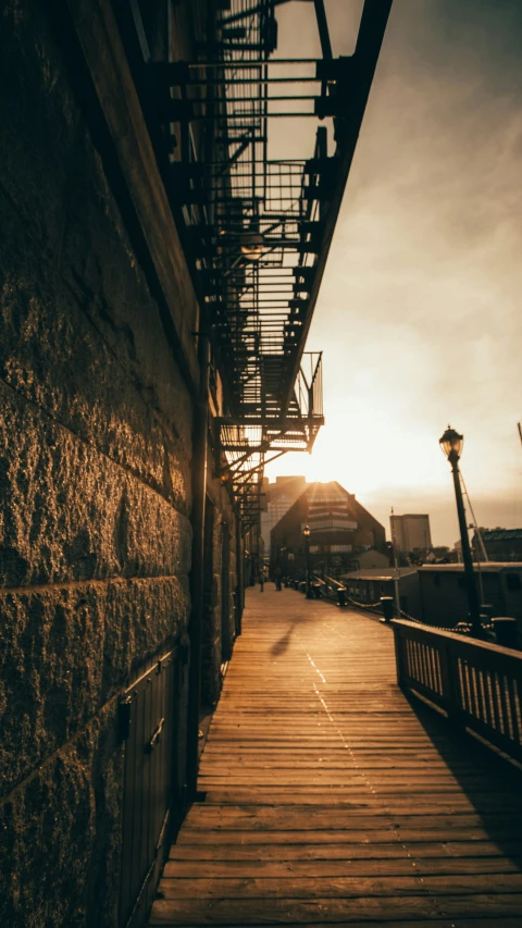 a wooden walkway going down an industrial area