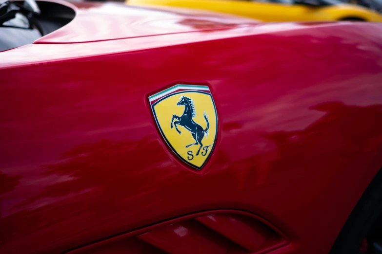 the emblem on a red car is shown