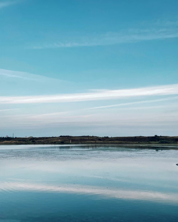 a sail boat is traveling out on the water