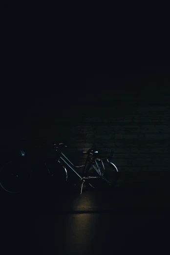 a blurry bicycle is sitting in the dark