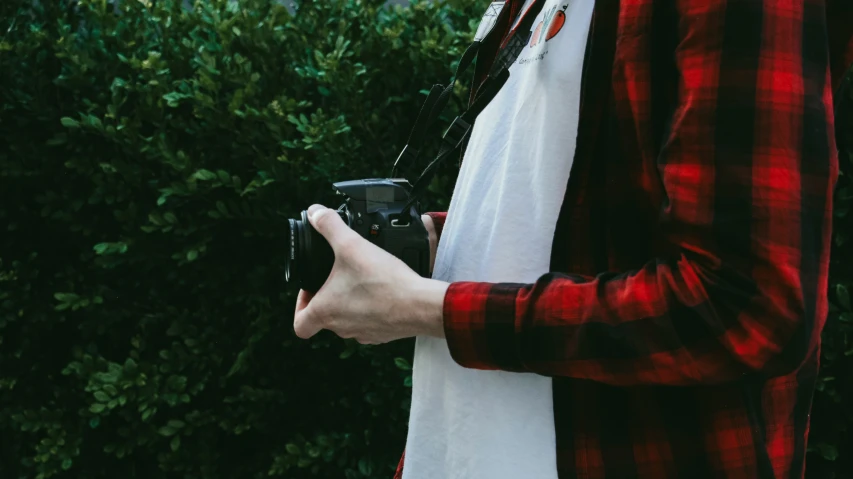 a person holding a camera taking a po with a camera