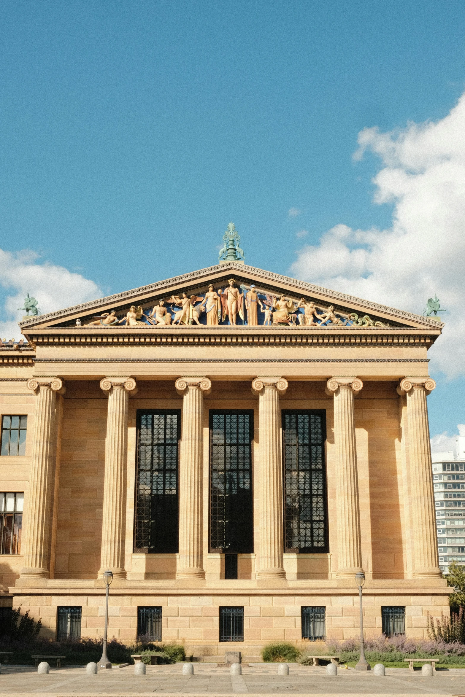 a very large brown building on top of a street