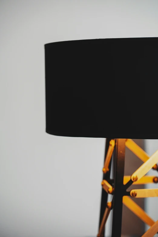 an illuminated table lamp sits atop a desk