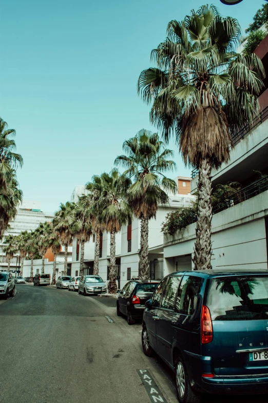 a bunch of cars that are parked in the street