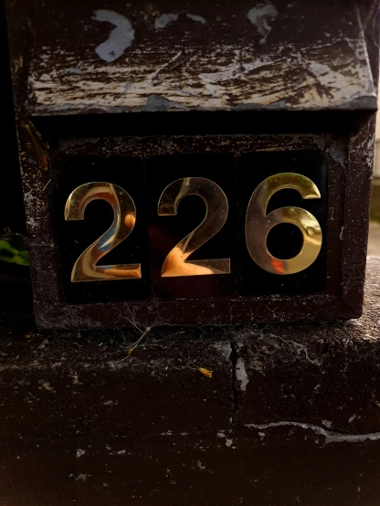 a clock on a pole displaying the number of two different numbers