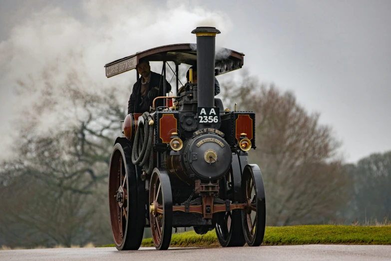 an old steam engine is sitting in the street