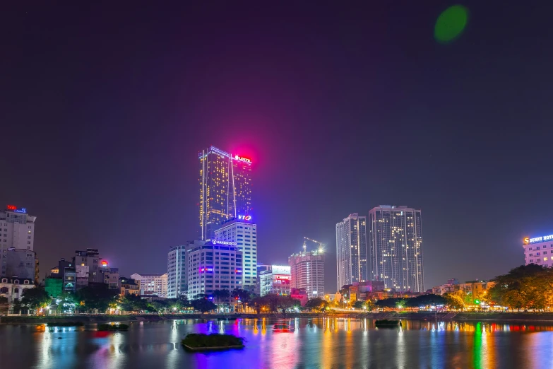 a beautiful city skyline with lights lit up at night