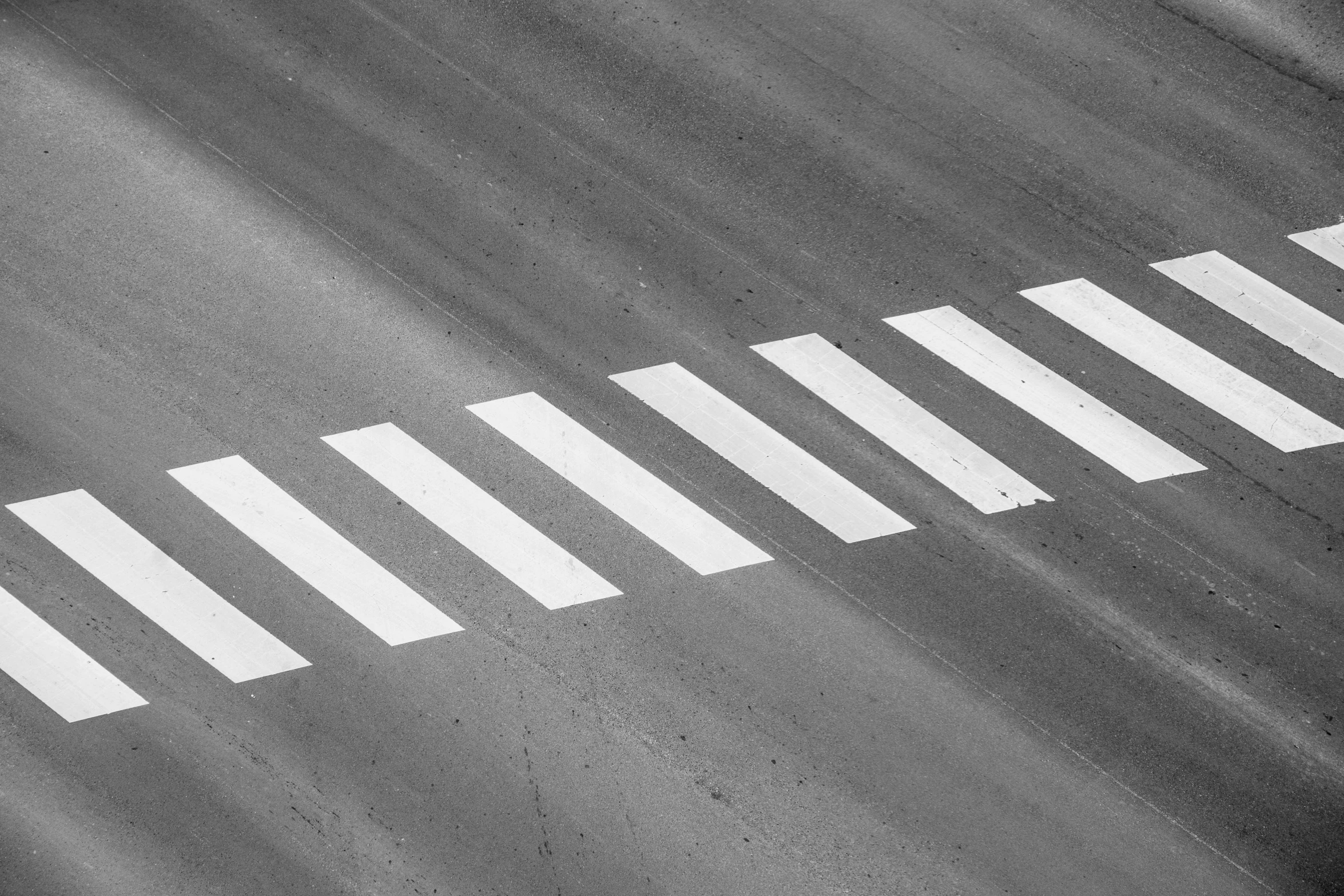 a black and white po of a road in a parking lot