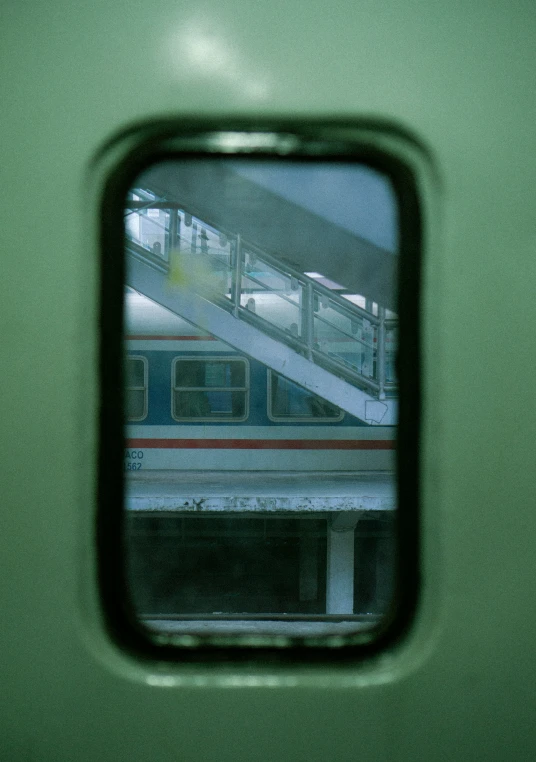 a view from a window into a subway platform