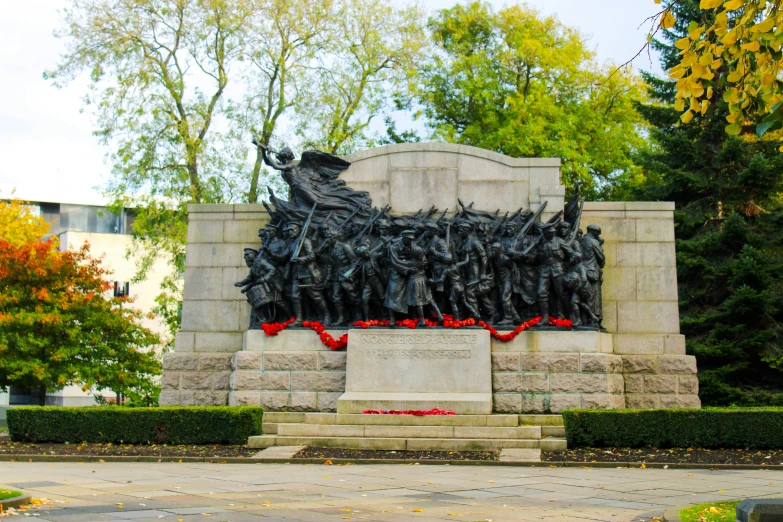 there is a monument with several people in the middle of it