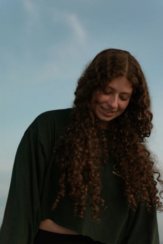 a woman that is smiling and has long hair