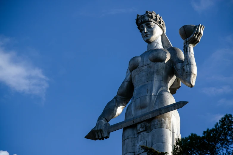 a statue of a warrior holding a sword