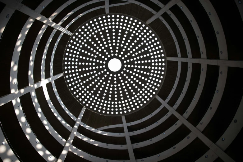 a circular design is shown in a dark room