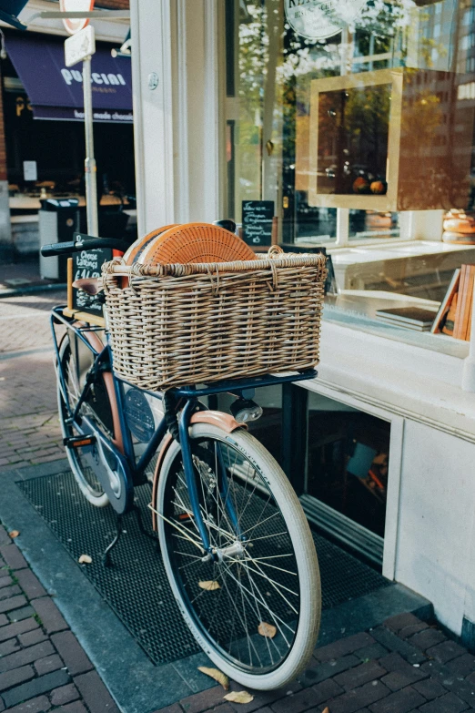 a bicycle is parked outside of a shop
