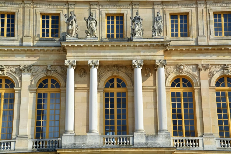 ornate and historical building with statues and pillars