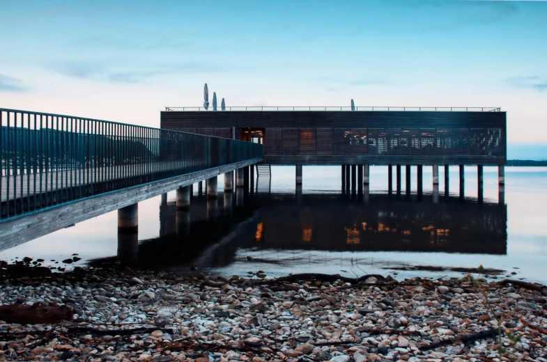 a dock with a bridge going into the water