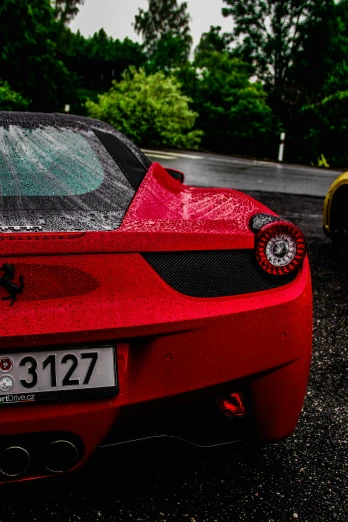 close up view of the rear of a red sports car