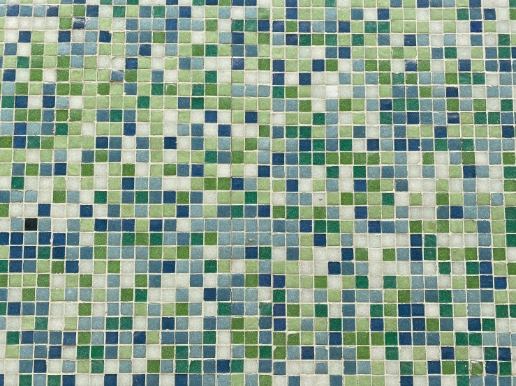 a mosaic pattern of different shades of green and blue