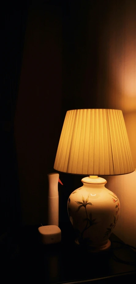 a table lamp on a desk with a light bulb on it