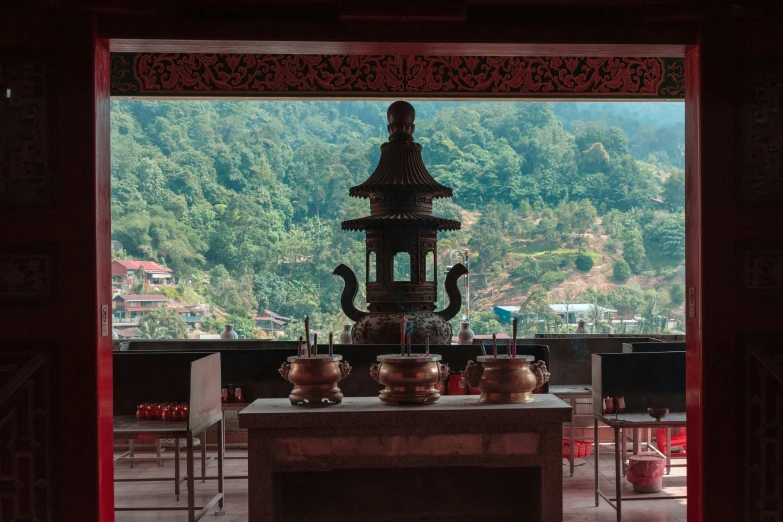 some vases in front of a shrine