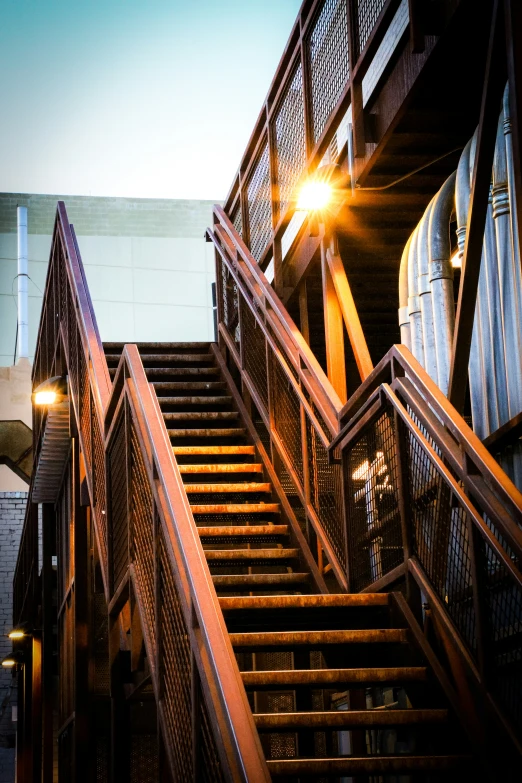 an escalator at night with the sun going down