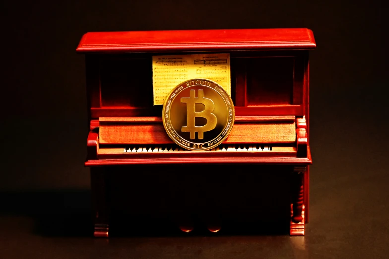 a toy model with a golden bitcoin on top of it