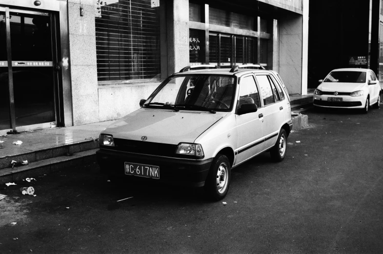 an old van is parked outside of a building