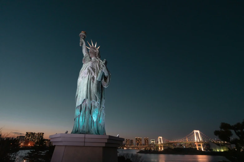 the statue of liberty is shown at night