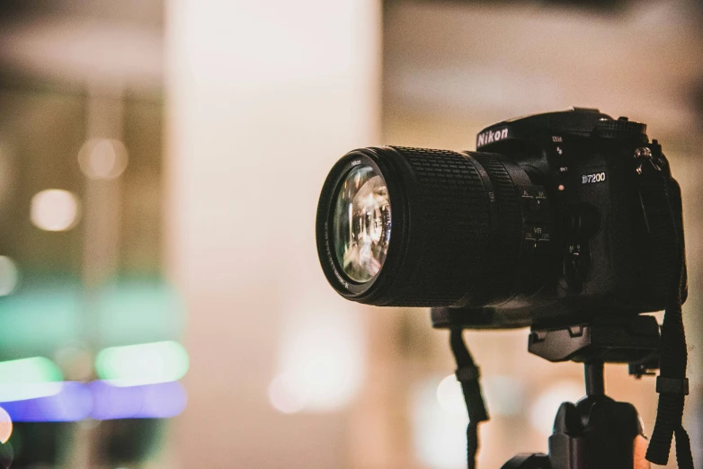 closeup of camera on tripod in urban area