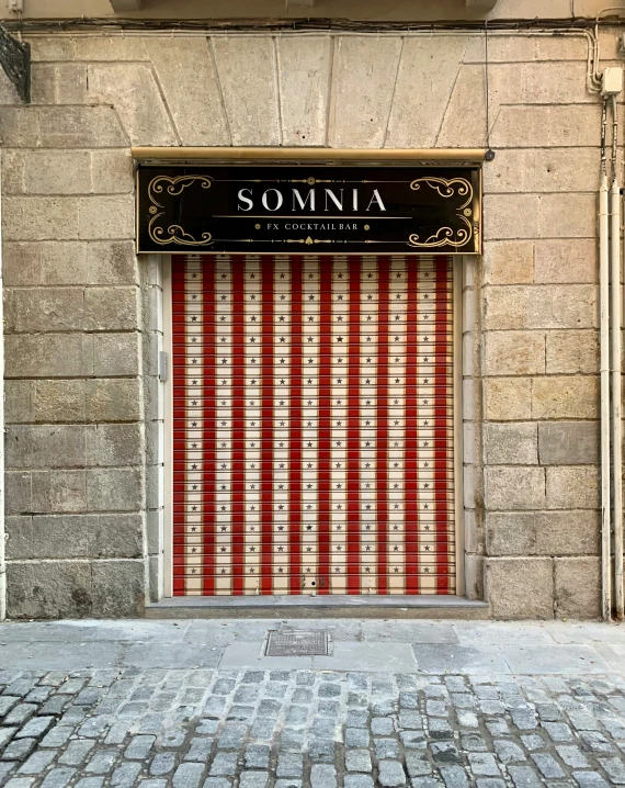 a building has a large red and white door