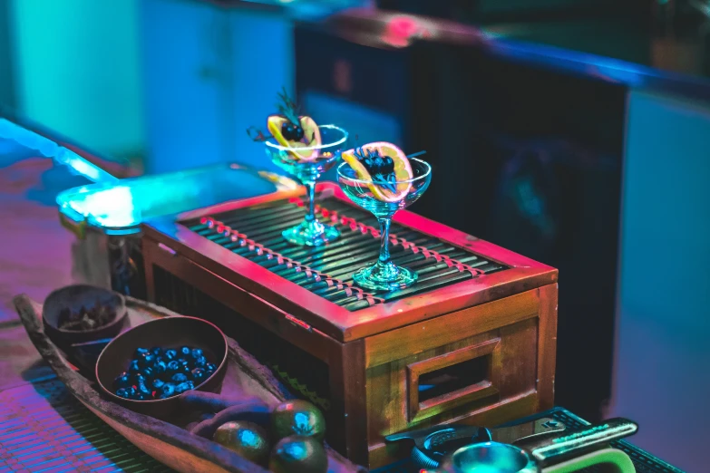 a music box on a table and some glasses on it