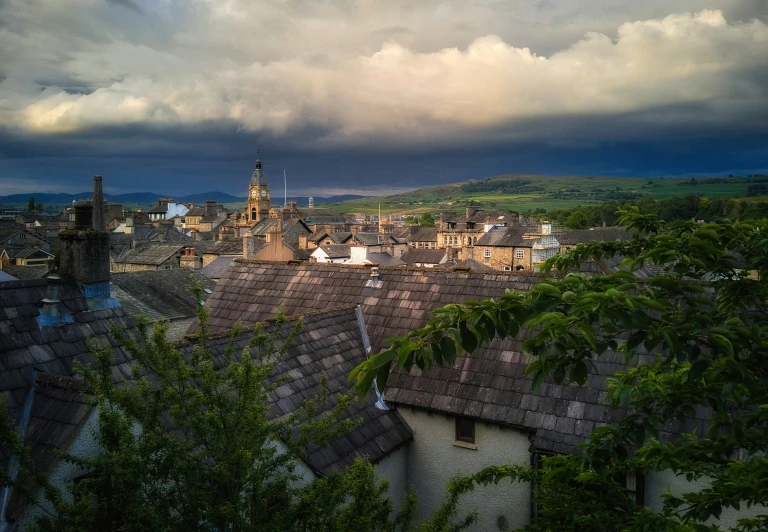 the city of a very large town below a cloudy sky