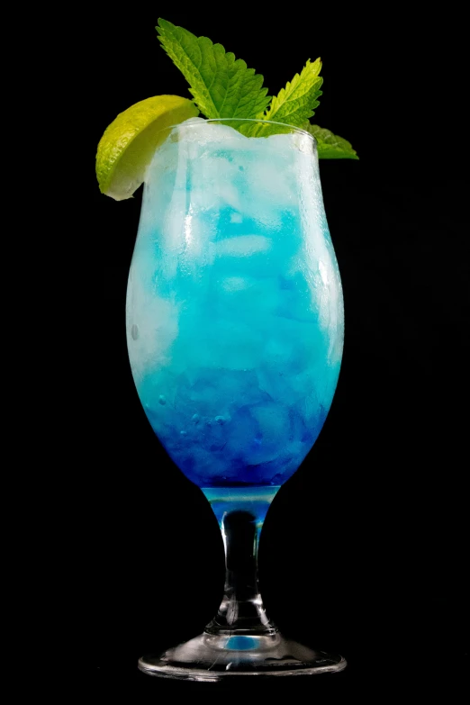 the drink has blue liquid, and green leaves