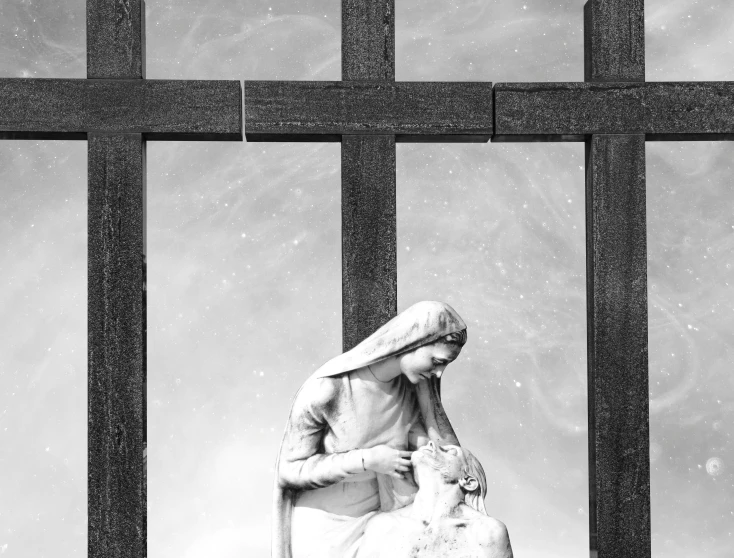 a woman holding a stuffed animal while standing behind bars