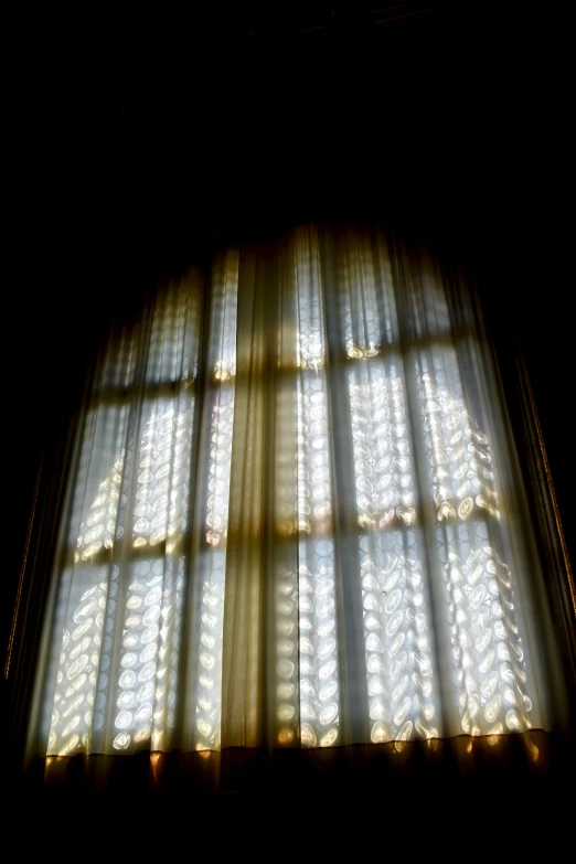 a dark image of a window with lights coming in