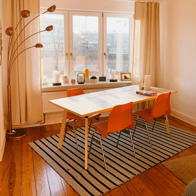 a kitchen with a dining room table and chairs