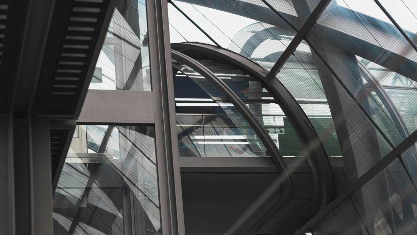 a walkway inside a metal structure that covers part of the building