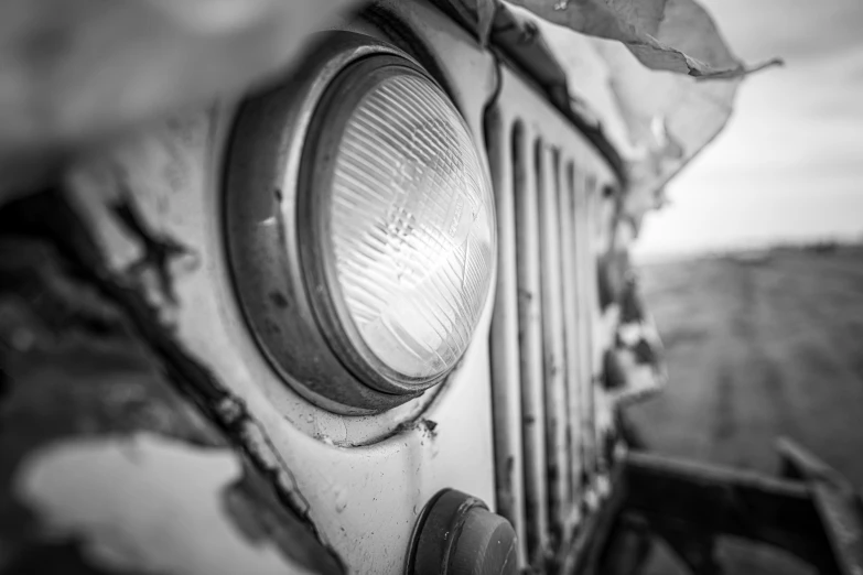 a close up of an old light with its reflection