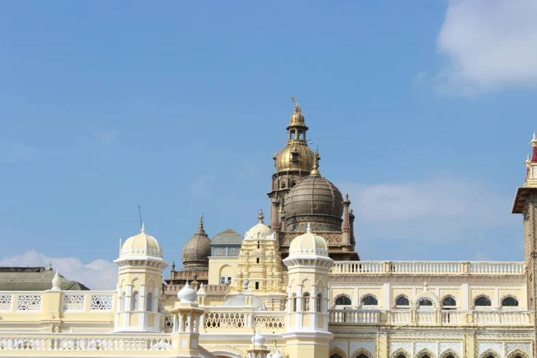 a building with a golden top that has a clock