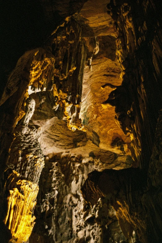 a cave entrance with sunlight streaming down