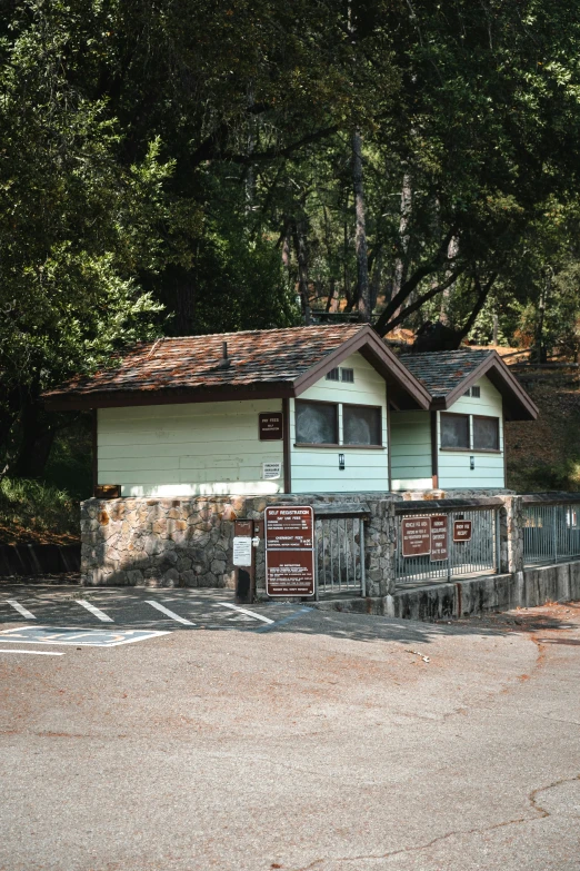 two buildings with wood posts sit near a street