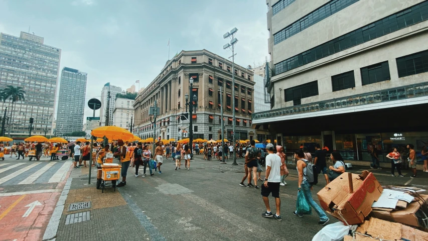 this po shows people walking on the side of a street in downtown