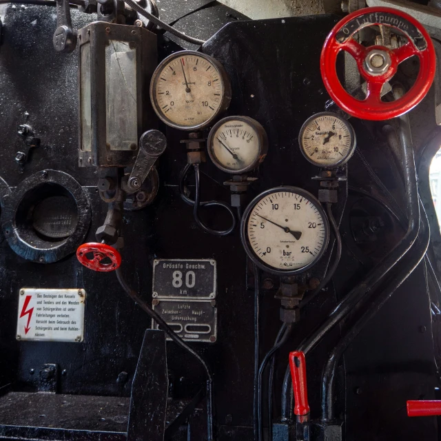 some gauges attached to the side of a train