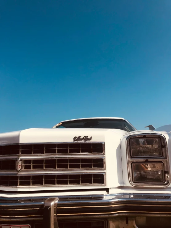 the front grills and bumper lights of a classic car