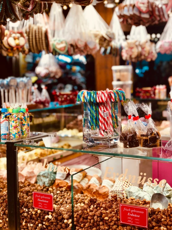 a glass shelf full of sweets and treats